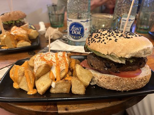 Black cat burger with bravas    at Cat Bar in Barcelona
