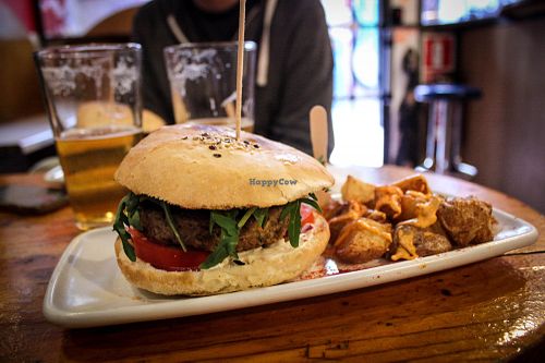 burger with patatas bravas at Cat Bar in Barcelona