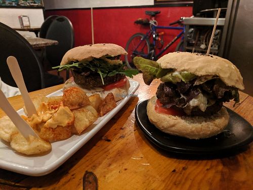 Champion + fries and black cat. at Cat Bar in Barcelona