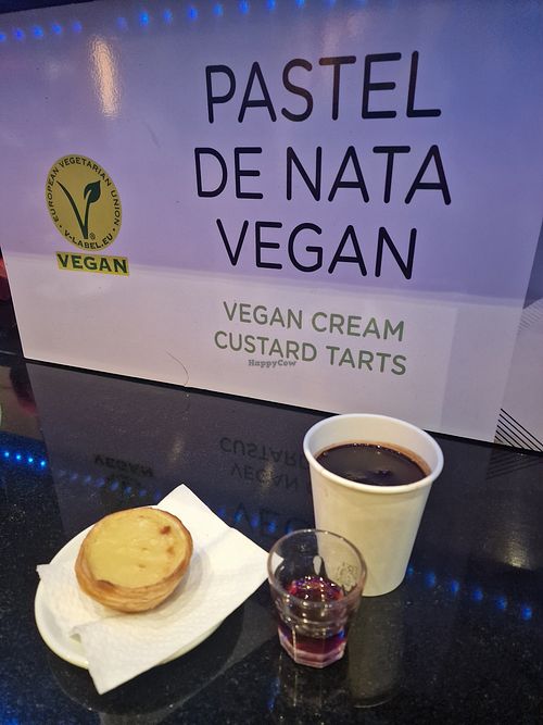 Pastel de nata with a shot of cherry liquor (1.50€) and super rich, thick hot chocolate at Vegan Nata - Chiado in Lisbon