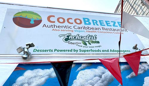 Note the outdoor sign highlighting healthy vegan options at Coco Breeze in Oakland