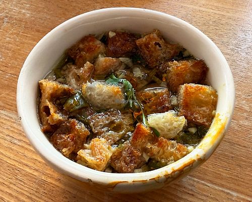 Soup of the week with coriander and croutons. at Pequeno Café e Bistrô - Arroios in Lisbon