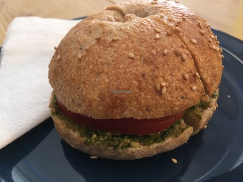Bagel with vegan pesto and tomato at Malabarista Cafe in Lisbon