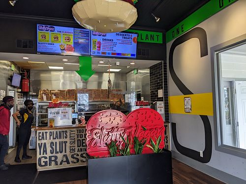 Menu over order counter at Slutty Vegan in Jonesboro