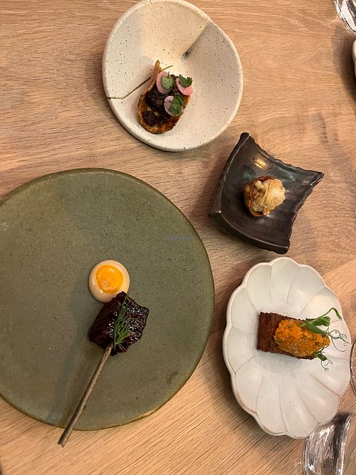 Selection of starters, including celery root taco, grilled red ace beet, and kennebec hash brown.  at Oyster Oyster in Washington