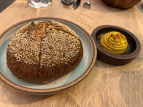 Sesame-leek bread with marigold “butter”  at Oyster Oyster in Washington