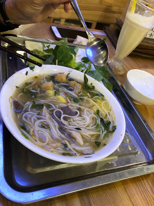 Hue style noodle dish with banana juice at Loving Hut - Âu Cơ in Hanoi
