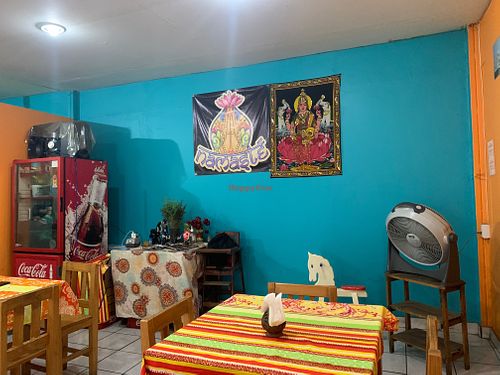 Interior seating with cheerful colors at Mónica Restaurant Hindú in Oaxaca