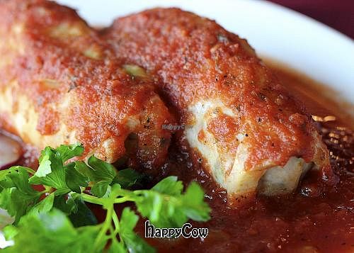 Vegan Stuffed Cabbage Rolls with Textured Veggie Protein, yellow split peas, Persian Basmati rice topped with a spicy yet tangy fresh tomato sauce.   at Cafe Natasha's Kabob International in St Louis