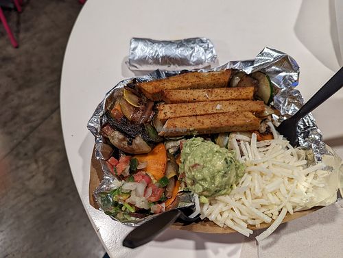 The fajita bowl. The rice and beans, under the guac, were very tasty. at Pepitas Vegan Taqueria in Denton