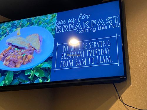 Scrolling restaurant advert  at World Fusion in Lecanto