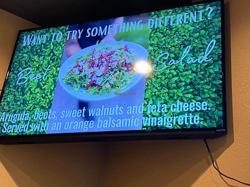 Advertising in dining room this one shows a salad at World Fusion in Lecanto