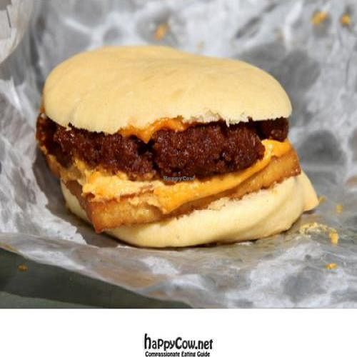 vegan breakfast sandwich: sausage, tofu, and cheese on a fluffy muffin at A Taste of Life in Inglewood