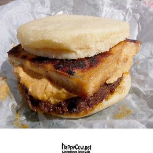 vegan breakfast sandwich: sausage, tofu, and cheese on a fluffy muffin at A Taste of Life in Inglewood