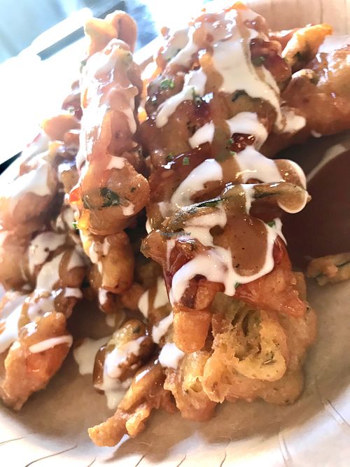 Spicy pakoras with zingy chutney at Fusca Vegan at The Neighbourhood  in Leamington Spa