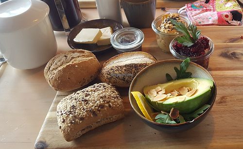 Vegan breakfast with butter, jam, hummus, vegetable spread and avocado. at Cafe Herr Nilsson in Seevetal