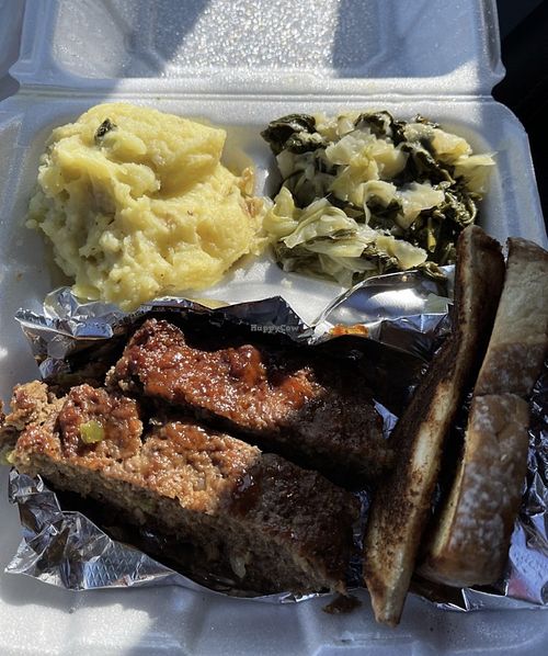 Impossible Meatloaf, greens, mashed potatoes, garlic bread. Delicious !  at Love At First Bite in St Ann