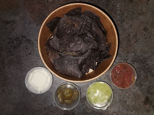 Nachos Azul: Blue corn tortilla nachos topped up with salsa ,pimento cheese and guacamole at Texcoco in Harrow