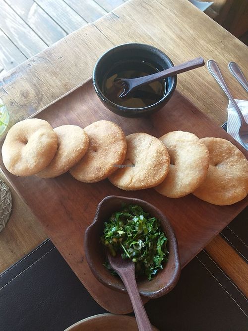 Sopaipillas (pumpkin fried bread) with Pebre and oil with merkeb spice at Cocina Mapuche Anita Epulef in Curarrehue