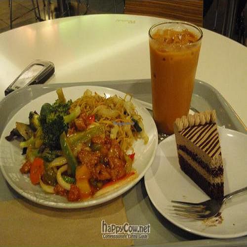 Mocha cake, thai iced tea, chow mein, sweet and sour fake chicken, garlic veggies. at Loving Hut - Westfield Mall Food Emporium in San Francisco