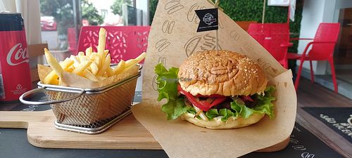 The vegan burger with a side of fries at Burger Grill 351 in Sao Vicente