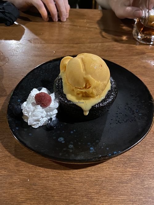 Chocolate cake with papaya ice cream and cardamom   at Chez Kessler in Barcelona