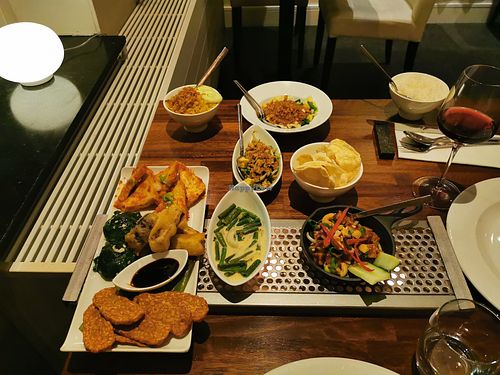 Different tasty vegan dishes, from spicy to almost sweet. Loads of vegetables, cashews, tempeh, two types of rice, tempura and a cold salad.  at Seray in Hillegom
