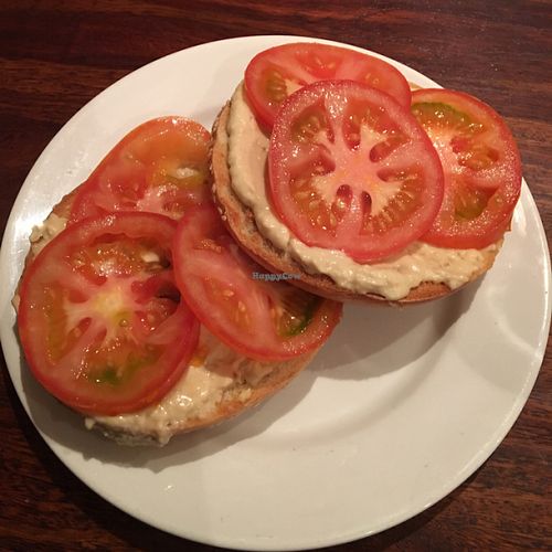 vegan hummus bagel with tomato  at GoKula Vegetarian Cafe in Watford