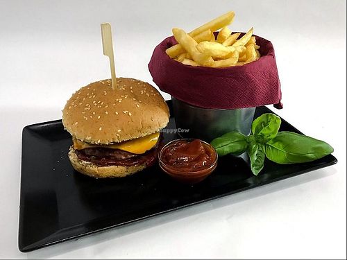 Beyond BBQ Burger with homemade BBQ sauce, caramelised onions, roasted bell peppers, vegan cheddar, french fries and BBQ dip. at Goblins Kitchen in Bratislava