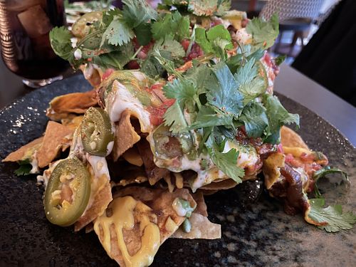 fully loaded nachos - huge pile at PLANTA Cocina in Toronto