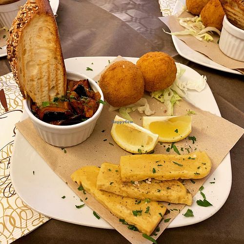 Traditional Sicilian cuisine - Aubergine Caponata, veggie Arancini Rice Balls, and Panelle (chickpea fritters) at Historic Route 66 Pub in Caltanissetta