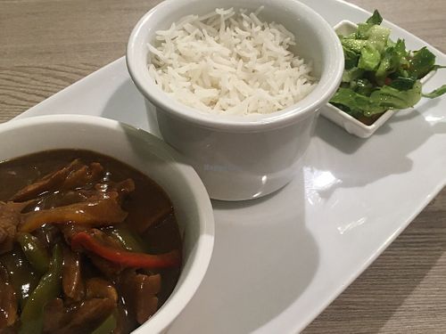 Soy meat gulasch, rice and green leaf veggies  at Just Vegan - Marina Walk Pearl in Dubai
