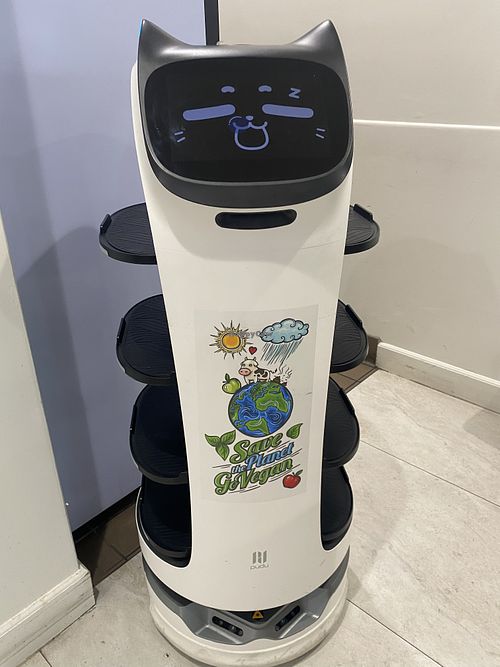 Save the Planet Sticker on Cat Robot for Bringing Food  at House of Fortune in Rowland Heights