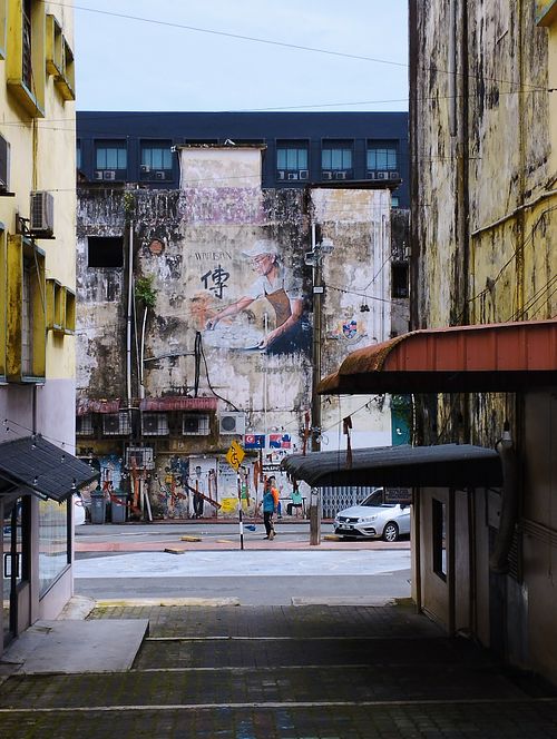 Cafe on the left when you see this wall art. at Origin Cafe 初 in Kulai