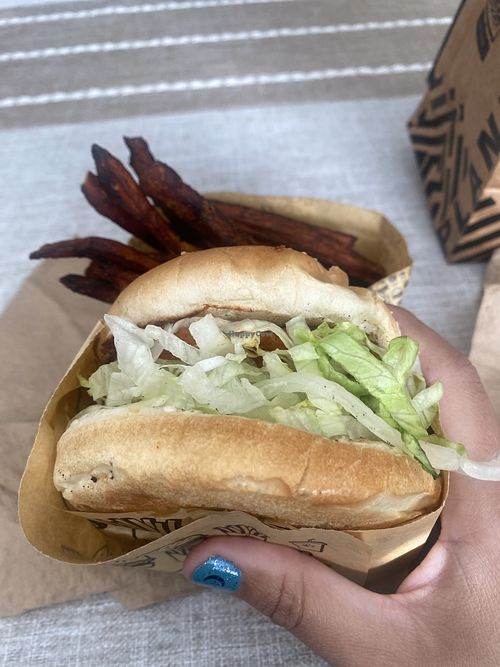 Ordered the 🌱 Buffalo Ranch Chick’n (again) SO GOOD, my  sweet potato fries were a LITTLE too crispy (burnt) for me. Recommend the Strawberry 🍓 Milkshake 💕😛  at Nice Burger - Santa Ana in Santa Ana