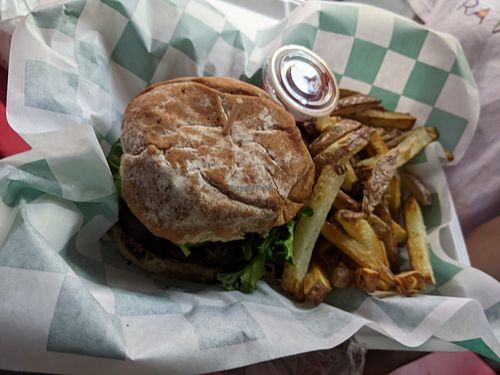 Heru smoked burger with fresh cut fries at RA Vegan Cafe in Houston