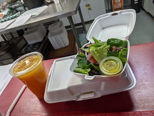 Organic garden salad with housemade dressing, Pineapple tonic at RA Vegan Cafe in Houston