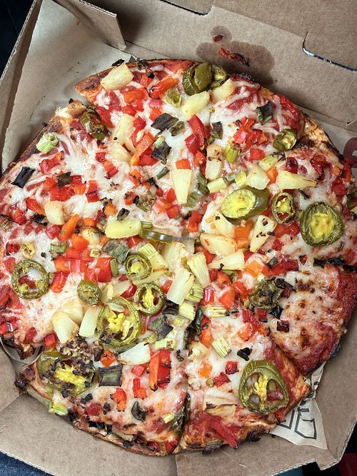 Build-your-own vegan pizza: 9” pan, classic red sauce, vegan cheese, red pepper, green onion, red onion, jalapeño, pineapple, roasted garlic.   at Rapid Fired Pizza in Englewood