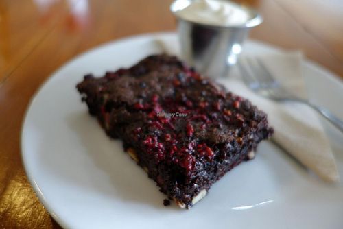 Amazing VEGAN BROWNIE with whipped Cashew cream.  at Cosset in Auckland