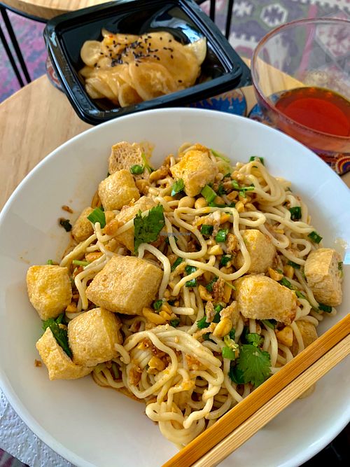 Dan dan noodles & marinated radish. at Noodle Master in Helsinki