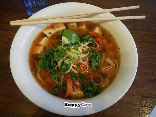 The 'Green Throughout' - Rice noodles and tofu in spicy vegetable broth with fresh chili, garlic, peppers, carrots, leek, parsley, and lime at Núðluskálin in Reykjavik