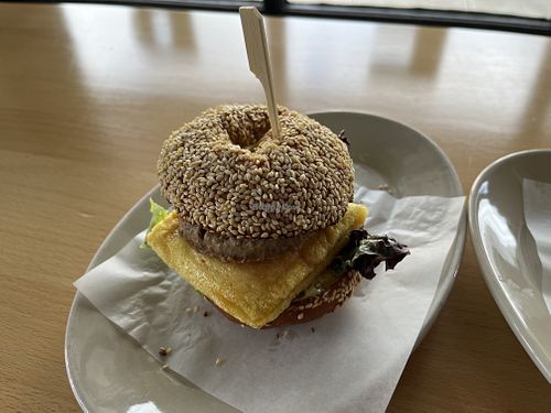 a bagel sandwich with vegan meat, egg, and cheese  at New Cascadia Traditional in Portland