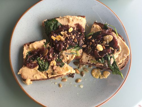 Hummus toast with caramelized onions at Kaya in Lisbon
