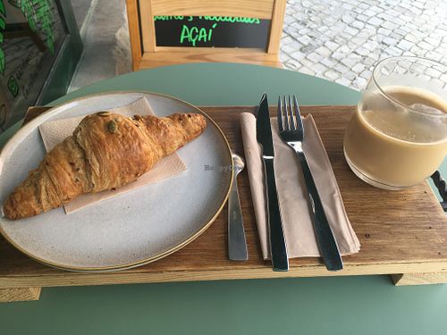 Vegan croissant and iced latte with oat milk at Kaya in Lisbon