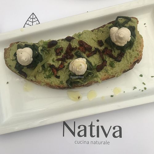 Bruschetta with fava Bean cream, dried tomatoes, chicory and almond ricotta  at Nativa in Rome