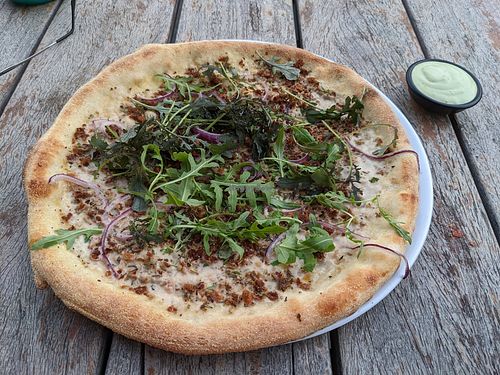 Pizza with dipping sauce at Vegan Pizza Bar in Rotterdam