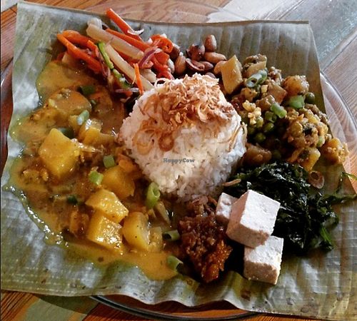 Special of the day. Fragrant rice served with tempeh and vegetables, pineapple green papaya curry, pickled diakon and carrot, tofu, sauteed greens, sambal and fried peanuts  at Carmo in New Orleans