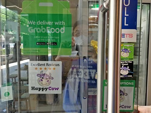 HappyCow app 5 stars EXCELLENT reviews decal at No Monkey Business in Northeast Singapore