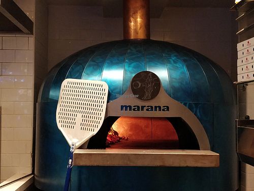 masonry oven in the kitchen at Cugini Trattoria Pizzeria in Central Singapore