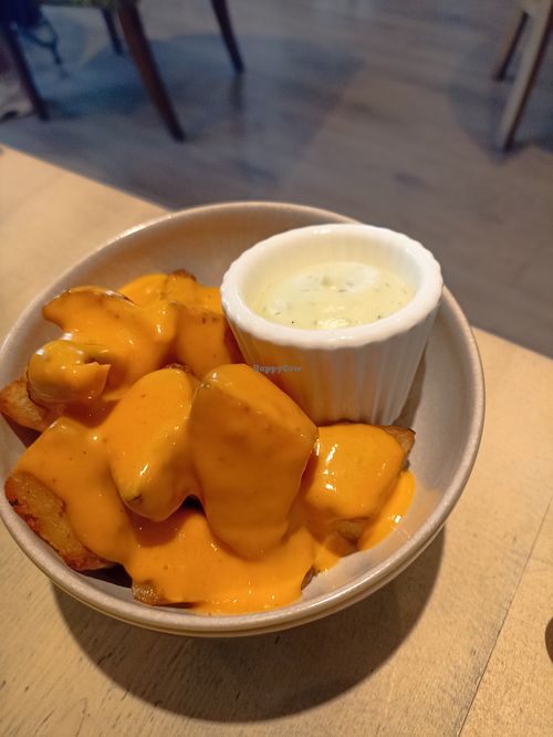 Roast Potatoes with a cheezy sauce and aioli dip 😋 at The Vibe in Liverpool